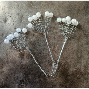 Spiraler p� pind med perler